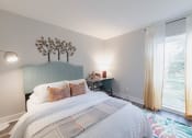 Thumbnail 18 of 24 - a bedroom with a bed and a rainbow painted wall