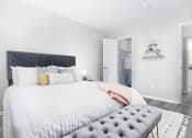 Thumbnail 8 of 35 - a bedroom with a large bed and a closet