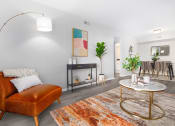Thumbnail 5 of 35 - a living room with a leather couch and a round table