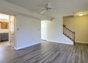 Thumbnail 42 of 51 - Mechanicsburg Apartments | Rockledge Townhomes |  a living room with hardwood floors and white walls