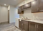 Thumbnail 6 of 20 - Mount Joy Senior Housing | a kitchen with a sink and a dishwasher