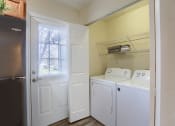 Thumbnail 36 of 51 - Mechanicsburg Apartments | Rockledge Townhomes |a laundry room with a washer and dryer