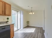 Thumbnail 49 of 51 - Mechanicsburg Apartments | Rockledge Townhomes |  a kitchen and dining area in a 555 waverly unit
