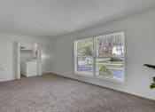 Thumbnail 25 of 26 - Apartments in Williamsport | Woodland Park |a living room with a large window and a sink in the corner of the room