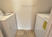 Thumbnail 29 of 39 - Harrisburg Apartment | Twin Lakes Apartments | a washer and dryer in a laundry room