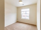 Thumbnail 17 of 20 - A room with a window and carpeted floor.