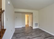 Thumbnail 35 of 51 - Mechanicsburg Apartments | Rockledge Townhomes |a bedroom with hardwood floors and white walls