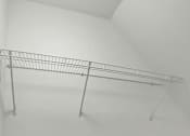 Thumbnail 34 of 39 - A metal rack is mounted on a white wall.