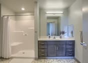 Thumbnail 18 of 20 - Mount Joy Senior Housing | a bathroom with a shower and a sink