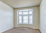 Thumbnail 4 of 18 - an empty room with a large window and white walls
