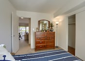 Thumbnail 26 of 39 - Harrisburg Apartment | Twin Lakes Apartments | a bedroom with a dresser with a mirror on top of it