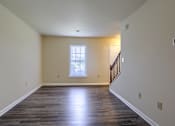 Thumbnail 42 of 58 - A room with wooden floors and a window.