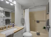Thumbnail 22 of 26 - Apartments in Williamsport | Woodland Park |a bathroom with a bathtub and a sink