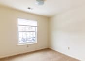 Thumbnail 15 of 20 - A room with a window and a ceiling fan.