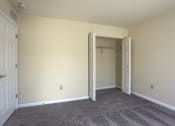 Thumbnail 51 of 51 - Mechanicsburg Apartments | Rockledge Townhomes | a bedroom with a closet and carpeted floor