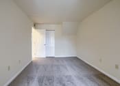 Thumbnail 39 of 51 - Mechanicsburg Apartments | Rockledge Townhomes |an empty room with a carpeted floor and a white door
