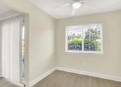 Thumbnail 4 of 39 - A room with a window and a ceiling fan.