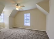 Thumbnail 45 of 58 - A room with a ceiling fan and a window.