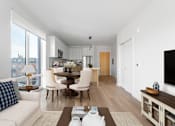Thumbnail 66 of 67 - A modern living room with a dining table and chairs.
