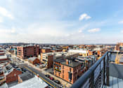 Thumbnail 22 of 67 - A cityscape with buildings and a clear sky.