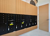 Thumbnail 16 of 67 - the lockers in the club room are lined up against the wall with a mural
