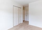 Thumbnail 10 of 20 - A white door is in a room with white walls.