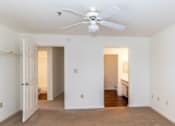 Thumbnail 20 of 20 - A room with a ceiling fan and two doors.