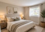 Thumbnail 40 of 48 - A bedroom with a large bed and two lamps on either side of the bed.