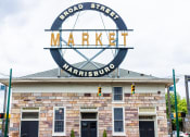 Thumbnail 7 of 18 - the sign for broad street market on top of a brick building