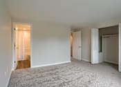 Thumbnail 27 of 48 - A room with carpeted floor and white walls.