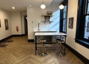 Thumbnail 18 of 26 - a dining area with a table and chairs in a room with a large window