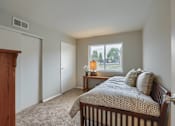 Thumbnail 12 of 16 - Mechanicsburg Apartments | Delbrook Manor Apartments | a bedroom with a bed and a nightstand