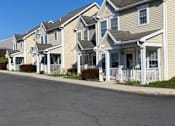 Thumbnail 19 of 20 - a row of houses on the side of a street