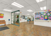 Thumbnail 5 of 18 - a large room with a large projection screen on the wall and a bench in front of a