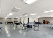 Thumbnail 7 of 18 - a large room with tables and chairs