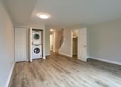 Thumbnail 6 of 48 - A laundry room with a washer and dryer in it.