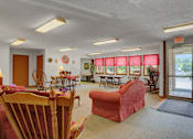 Thumbnail 7 of 15 - a living room filled with furniture and a large window