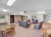 Thumbnail 6 of 14 - a living room with couches chairs and a table