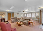 Thumbnail 7 of 14 - a living room with couches and chairs