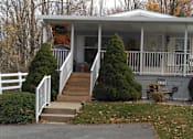 Thumbnail 5 of 5 - the front porch of a house with a porch swing