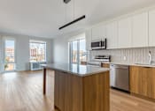 Thumbnail 29 of 73 - A kitchen with wooden cabinets and a countertop.