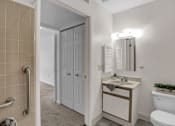 Thumbnail 15 of 16 - a bathroom with a toilet sink and shower