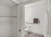 Thumbnail 16 of 16 - a bathroom with a toilet and a towel rack