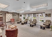 Thumbnail 5 of 16 - a waiting room with chairs and a piano