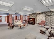 Thumbnail 7 of 16 - a living room filled with furniture and a piano