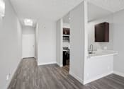 Thumbnail 8 of 53 - A kitchen with a white counter and a sink.