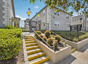 Thumbnail 15 of 40 - A set of yellow steps lead up to a building entrance.