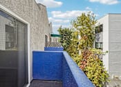 Thumbnail 2 of 66 - A blue wall with a black door and a window.