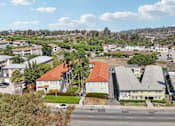 Thumbnail 45 of 51 - A view of a street with buildings on either side and a clear sky above.