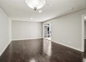 Thumbnail 42 of 66 - A room with a wooden floor and a white ceiling.